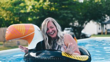 smiling woman on inflatable raft